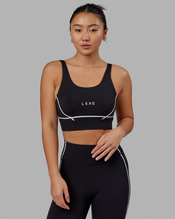 Woman wearing Pulse Sports Bra - Black