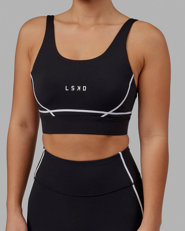 Woman wearing Pulse Sports Bra - Black