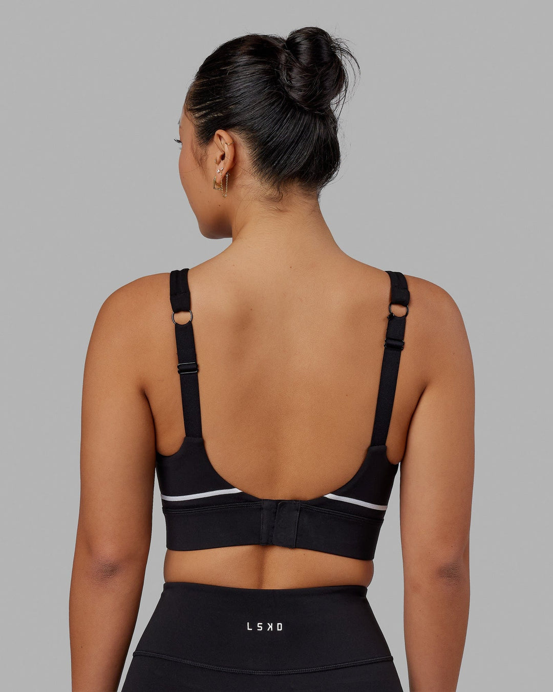 Woman wearing Pulse Sports Bra - Black