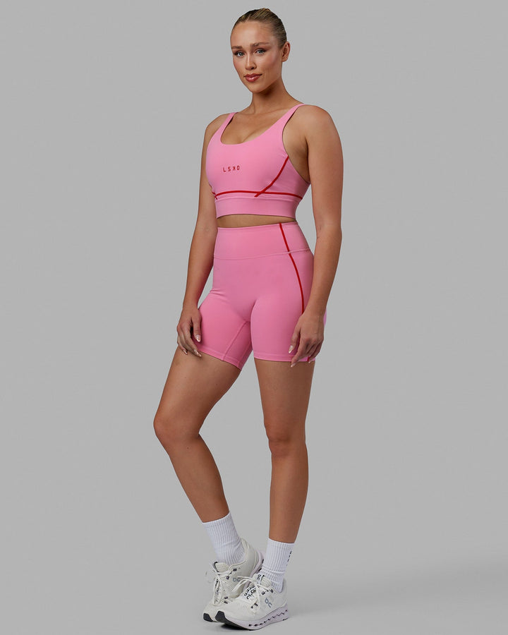 Woman wearing Pulse Sports Bra - Pink Rose-Scarlet