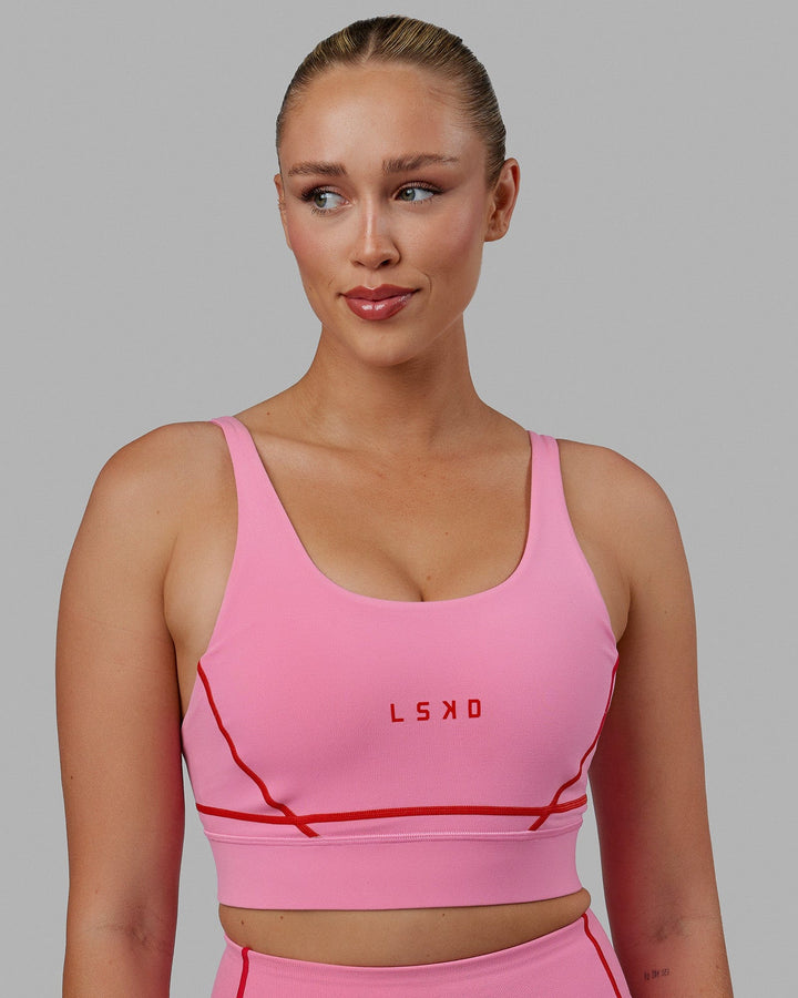 Woman wearing Pulse Sports Bra - Pink Rose-Scarlet
