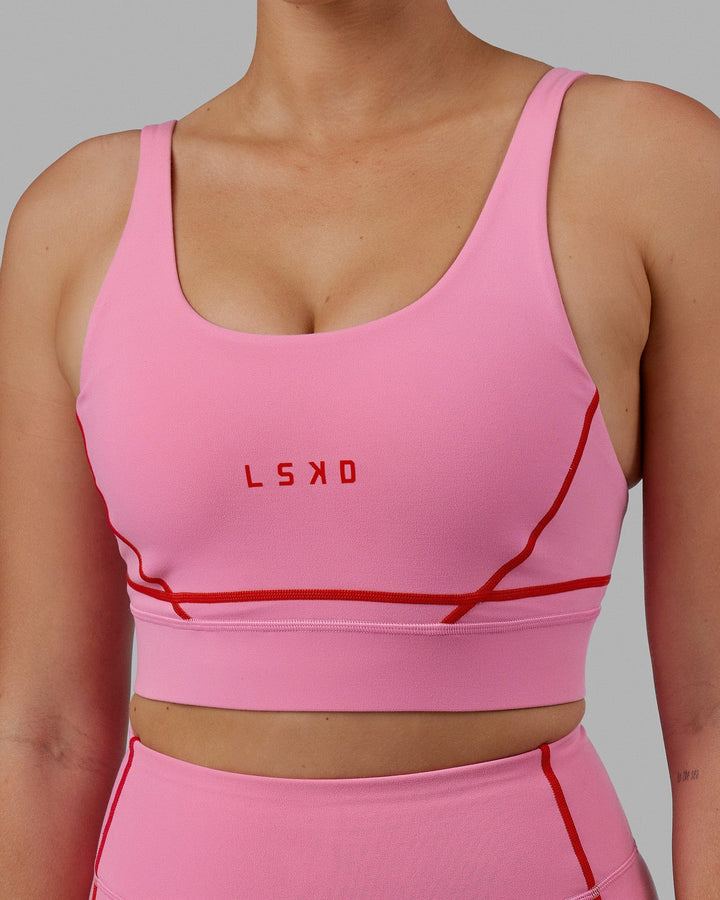Woman wearing Pulse Sports Bra - Pink Rose-Scarlet
