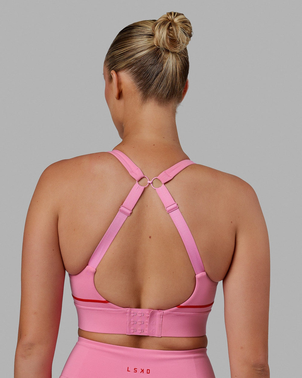 Woman wearing Pulse Sports Bra - Pink Rose-Scarlet