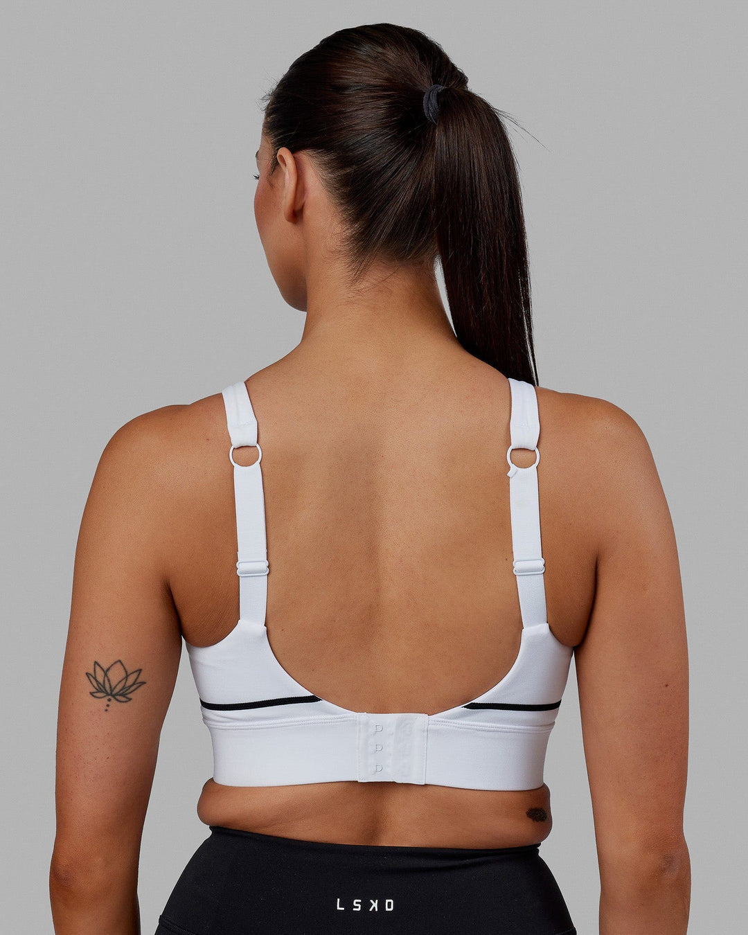 Woman wearing Pulse Sports Bra - White