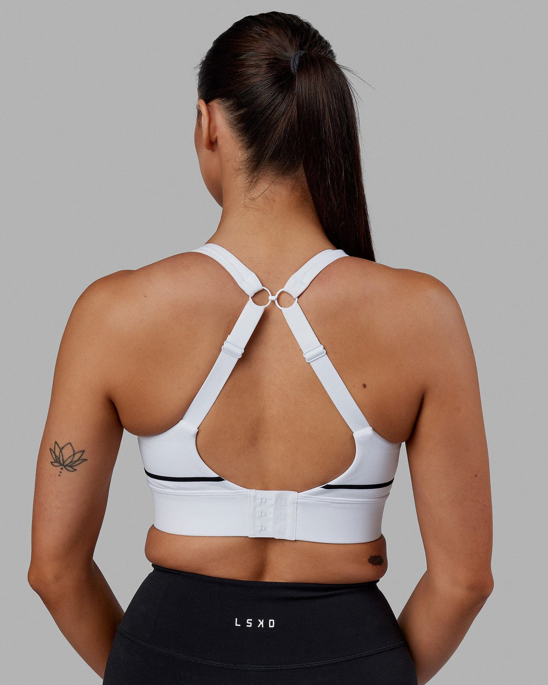 Woman wearing Pulse Sports Bra - White