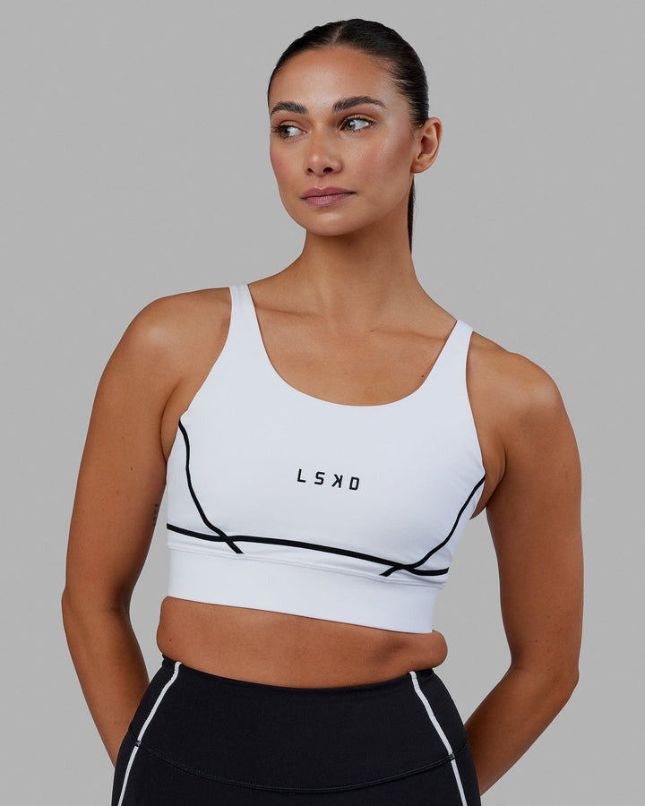 Woman wearing Pulse Sports Bra - White