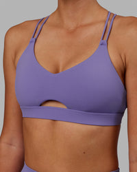 Woman wearing Pursue Sports Bra - Dahlia Purple