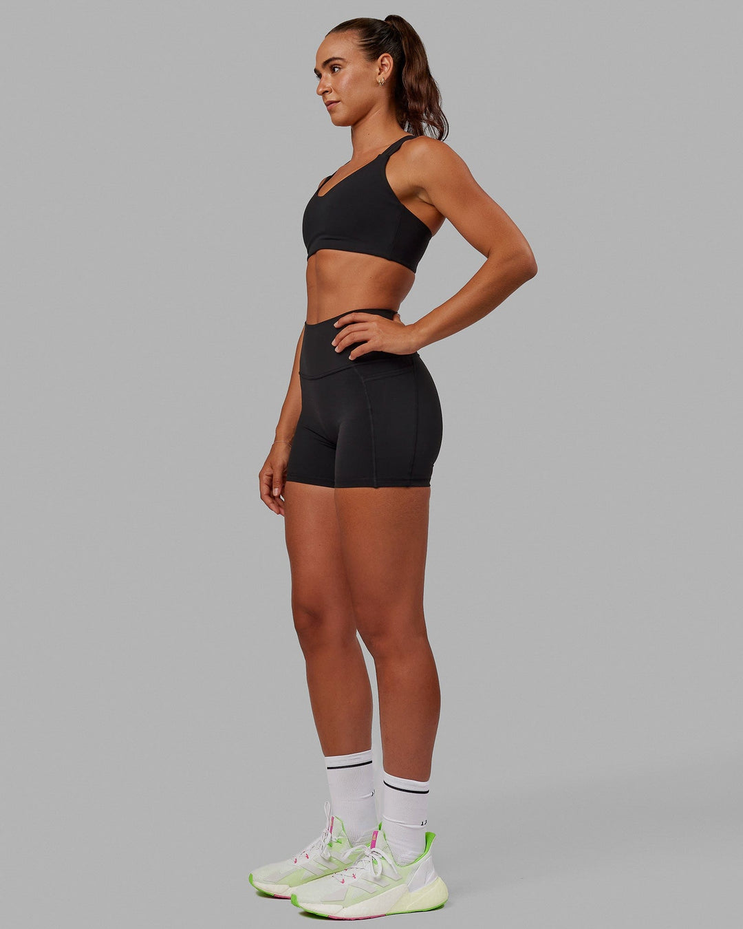 Woman wearing Push The Limit Sports Bra - Black