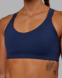 Woman wearing Push The Limit Sports Bra - Future Navy