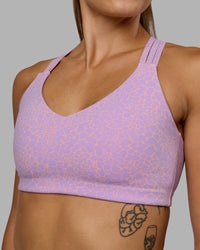 Woman wearing Push The Limit Sports Bra - Pale Lilac Vitality Print