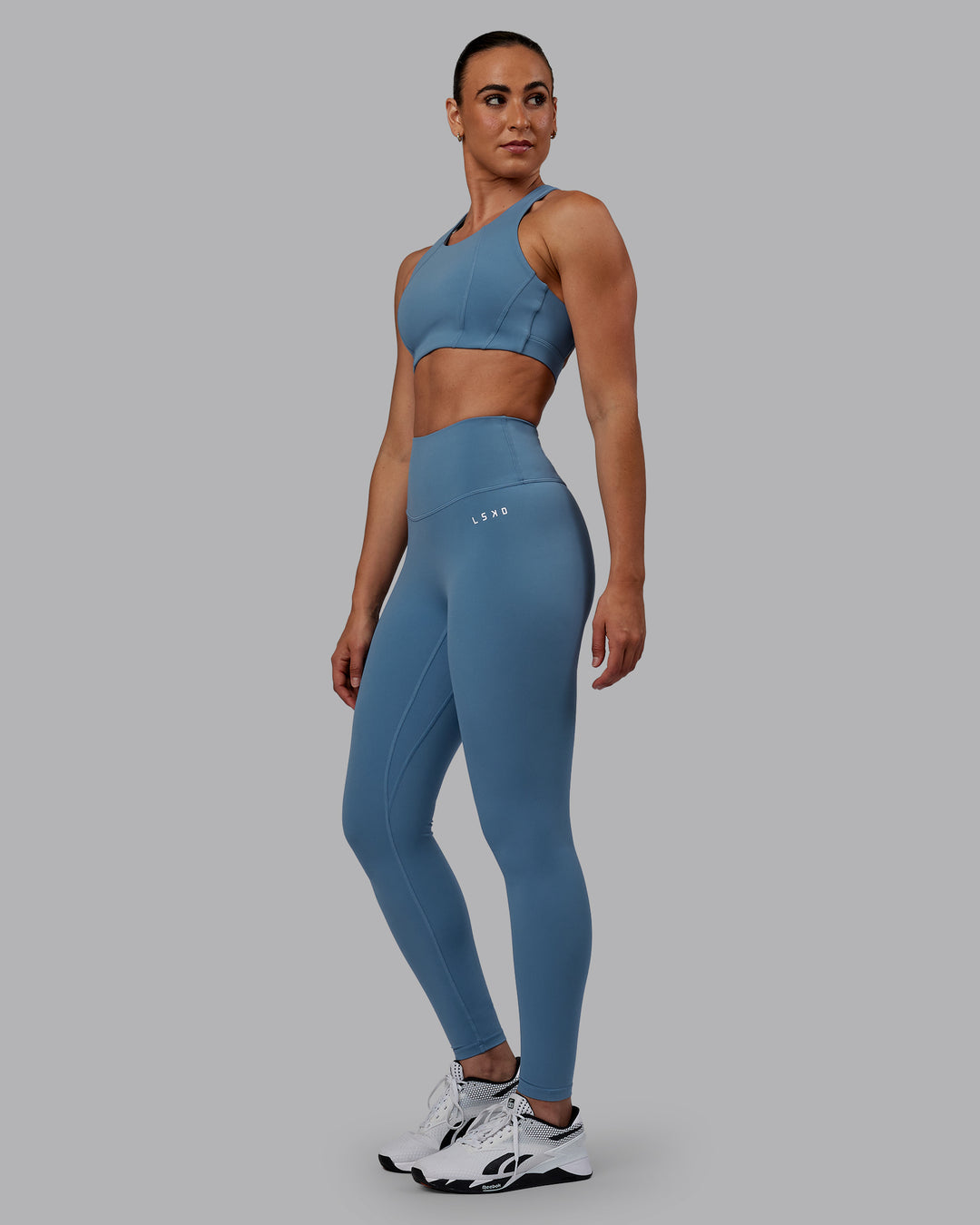 Woman wearing RXD High-Rise Full Length Legging - Elemental Blue