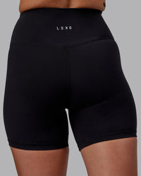 Woman wearing RXD High-Rise 6" Short - Black