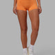 Woman wearing RXD Micro Short Tights - Tangerine