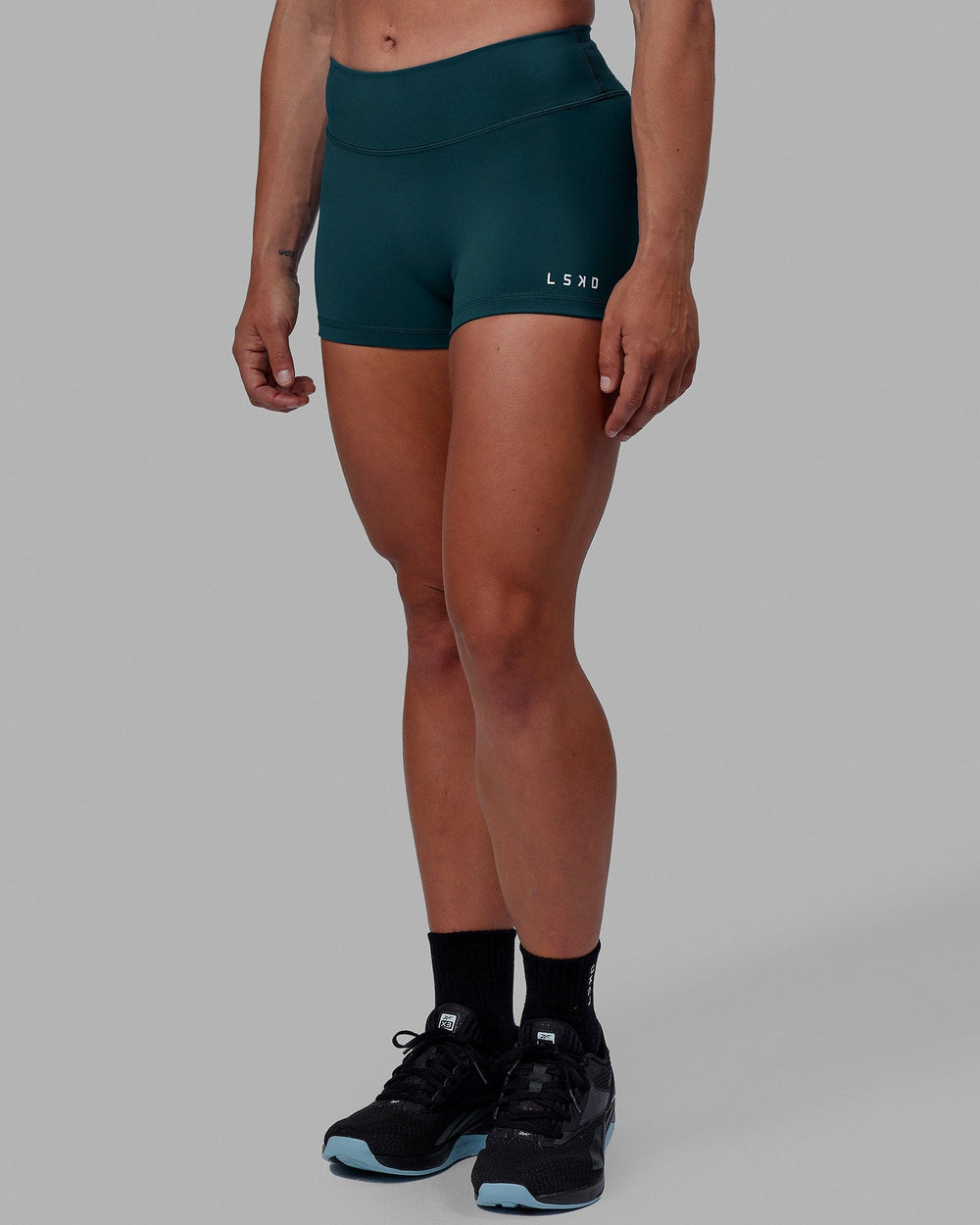 Woman wearing RXD Micro Short Tights - Tidal Teal