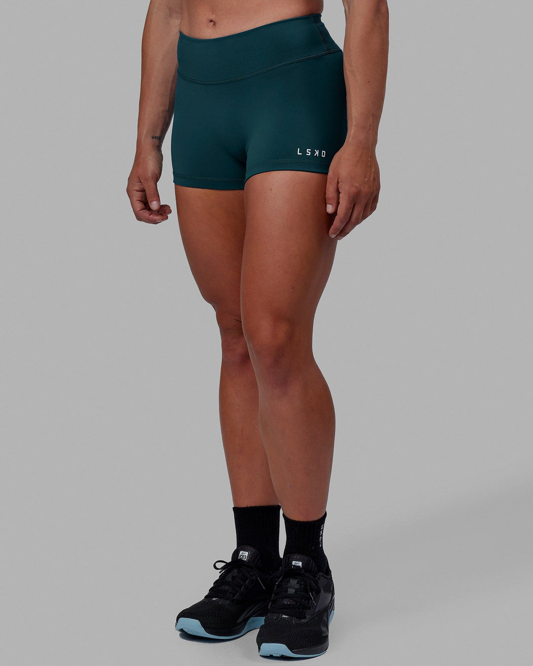 Woman wearing RXD Micro Short Tights - Tidal Teal