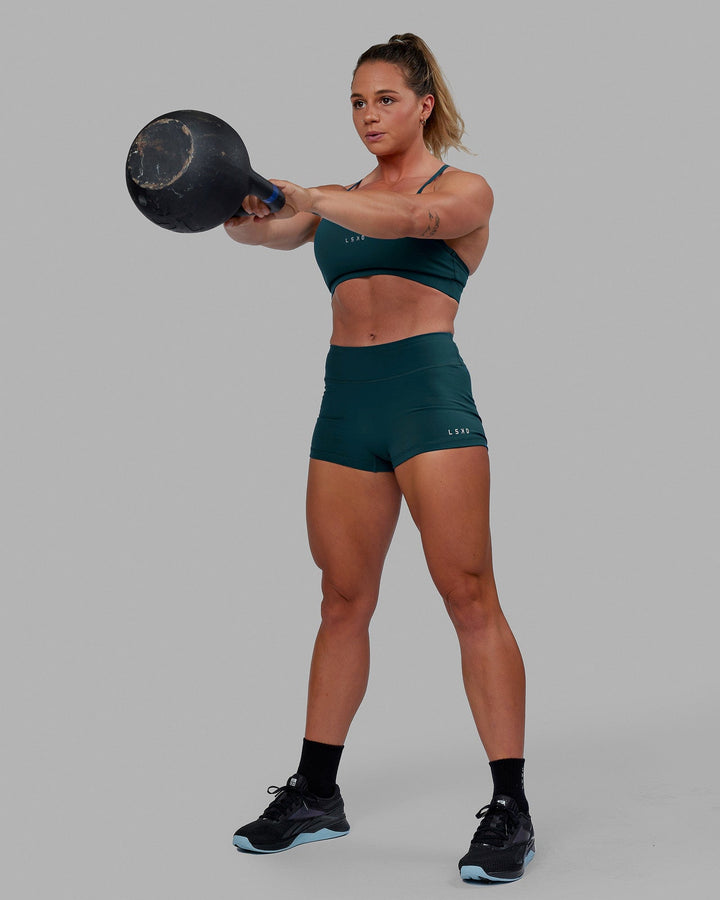 Woman wearing RXD Micro Short Tights - Tidal Teal