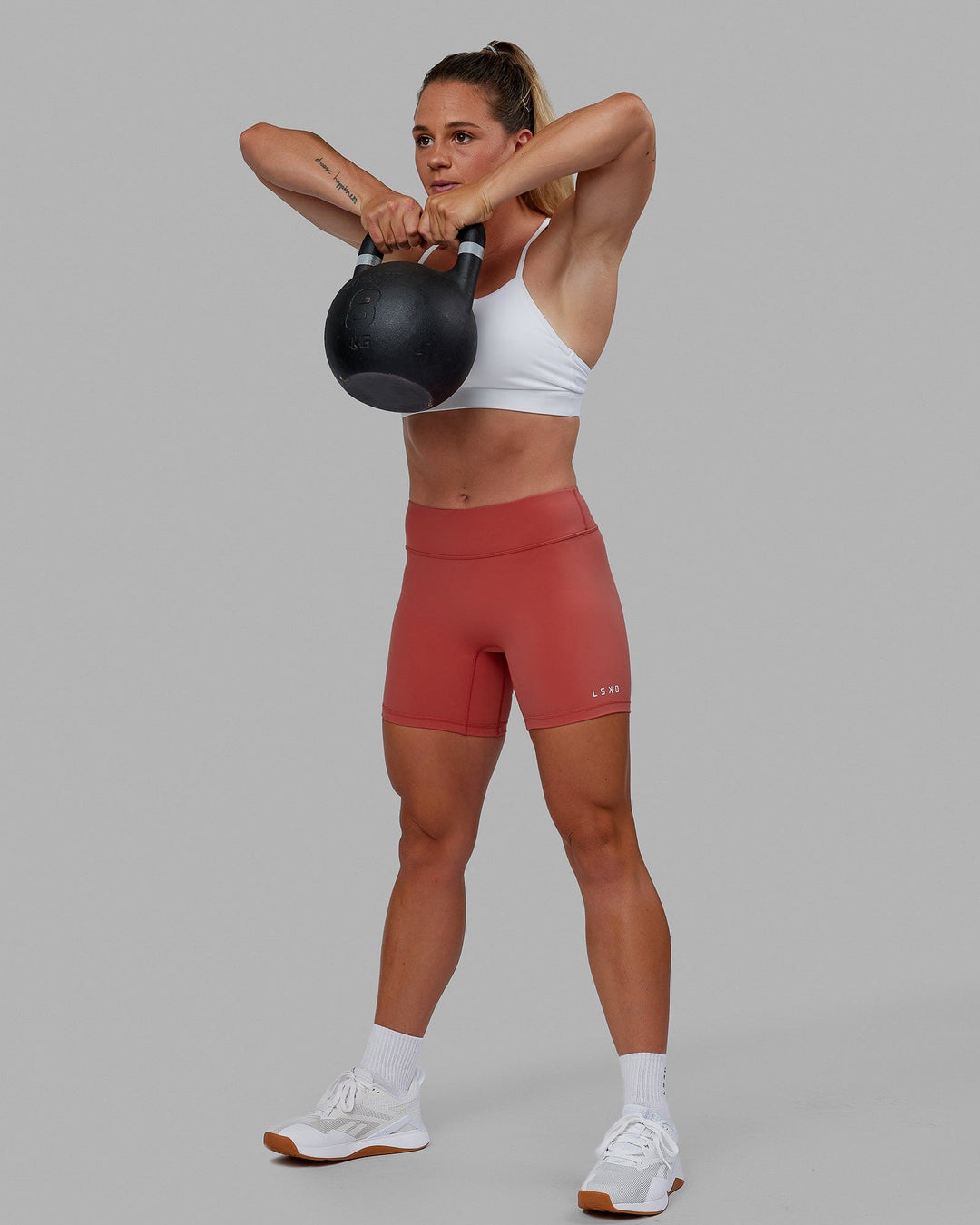 Woman wearing RXD Mid Short Tight - Mineral Red