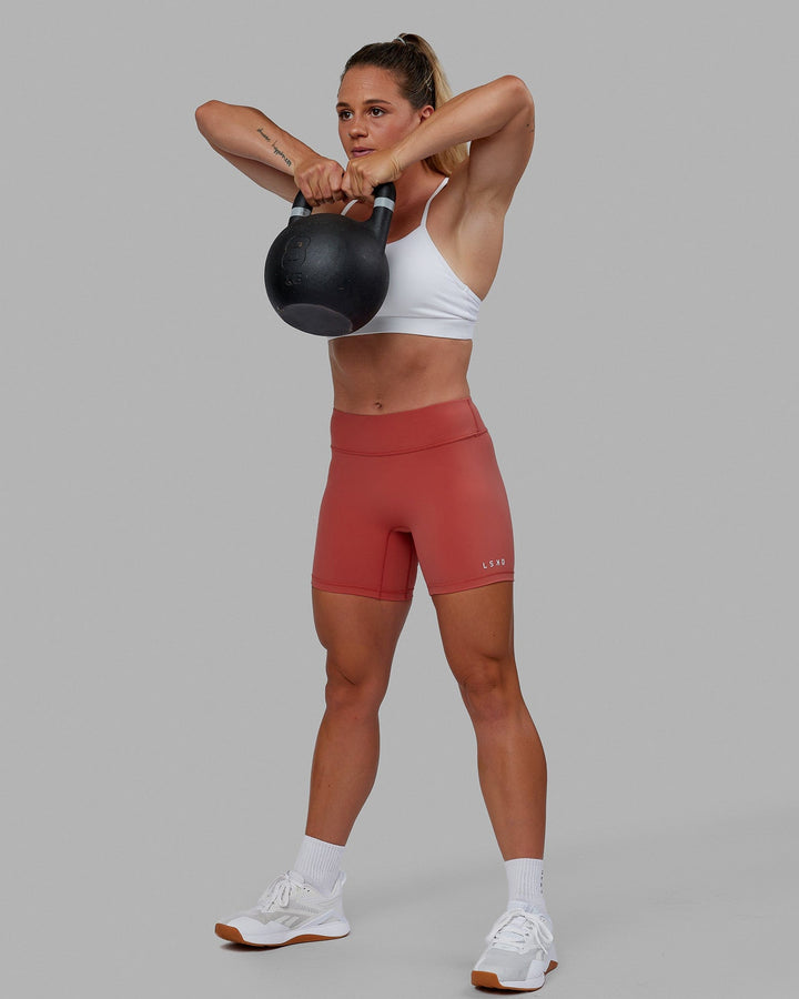 Woman wearing RXD Mid Short Tight - Mineral Red