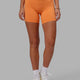 Woman wearing RXD Mid Short Tight - Tangerine
