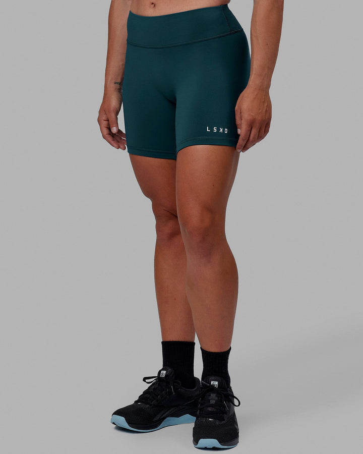 Woman wearing RXD Mid Short Tight - Tidal Teal