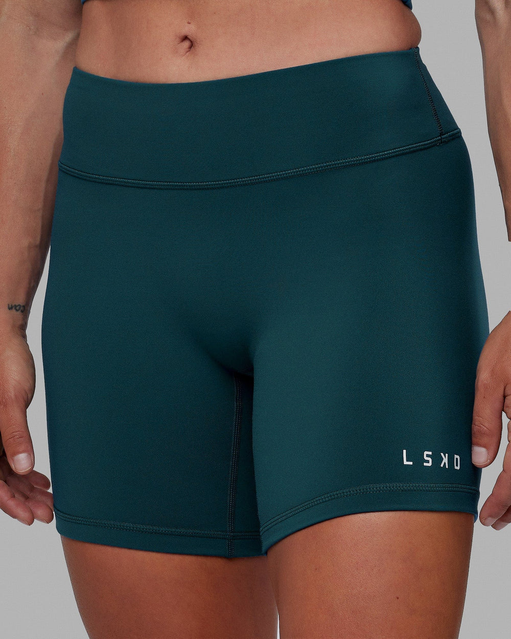 Woman wearing RXD Mid Short Tight - Tidal Teal