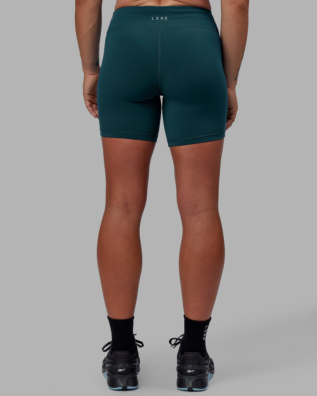 Woman wearing RXD Mid Short Tight - Tidal Teal
