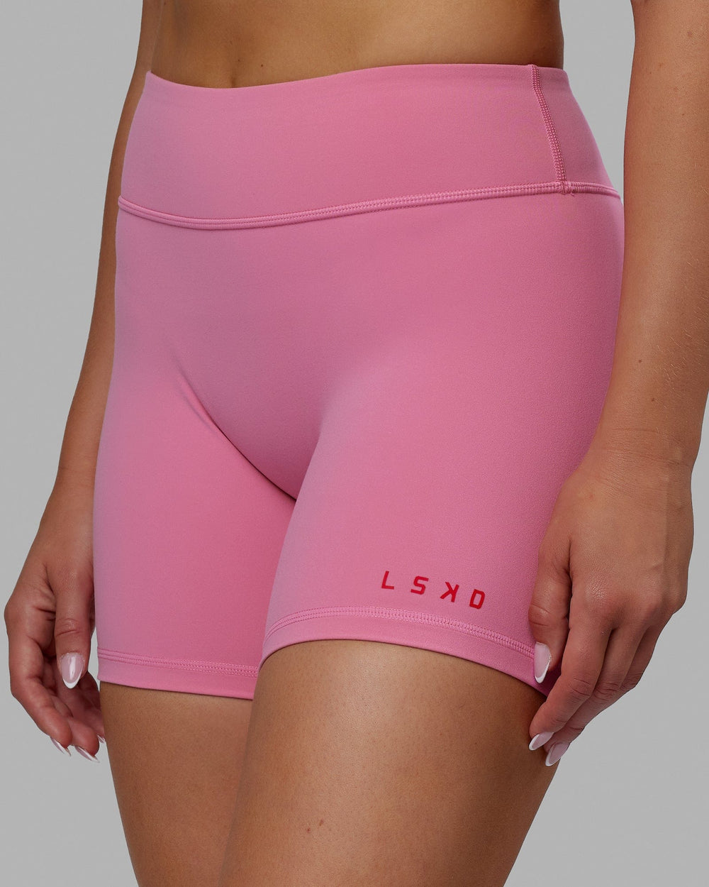 Woman wearing RXD Mid Short Tights - Pink Rose-Scarlet