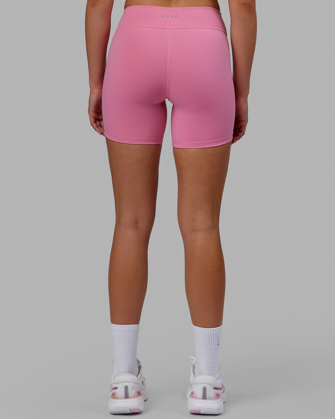 Woman wearing RXD Mid Short Tights - Pink Rose-Scarlet