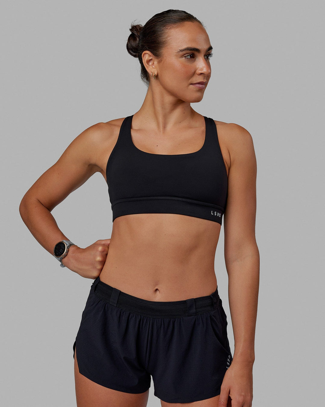 Woman wearing Race Day Sports Bra - Black