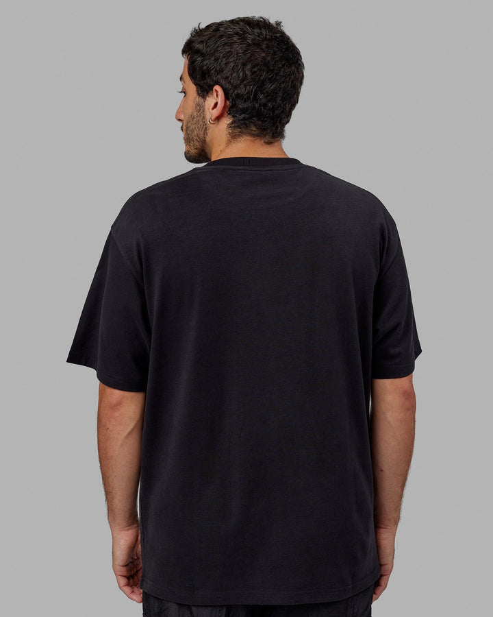 Man wearing Unisex Radiate Heavyweight Tee Oversize - Black