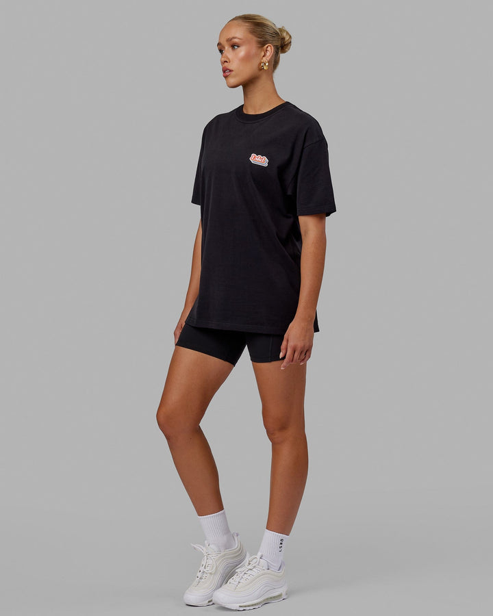 Woman wearing Unisex Radiate Heavyweight Tee Oversize - Black