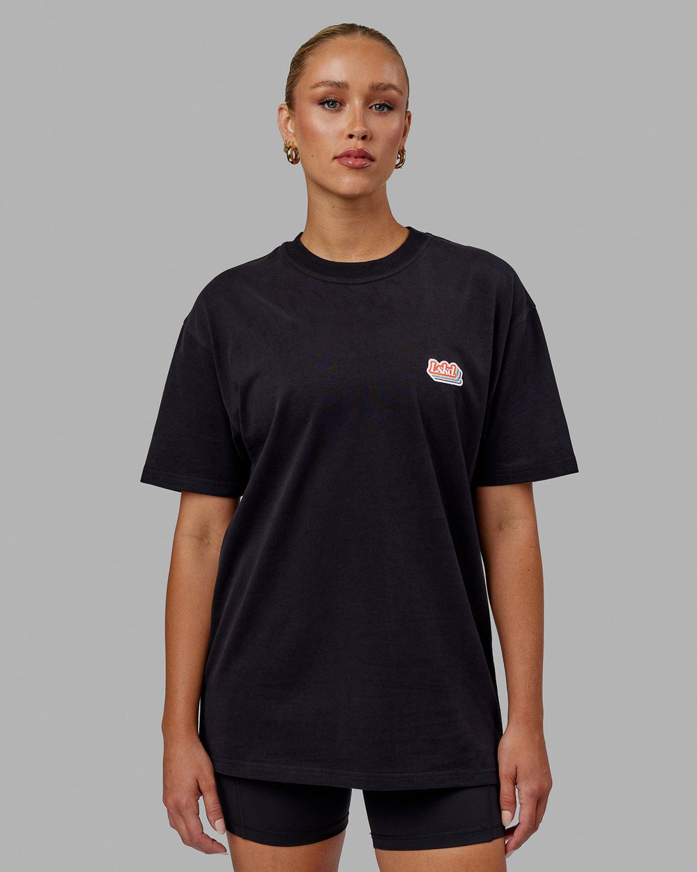 Woman wearing Unisex Radiate Heavyweight Tee Oversize - Black