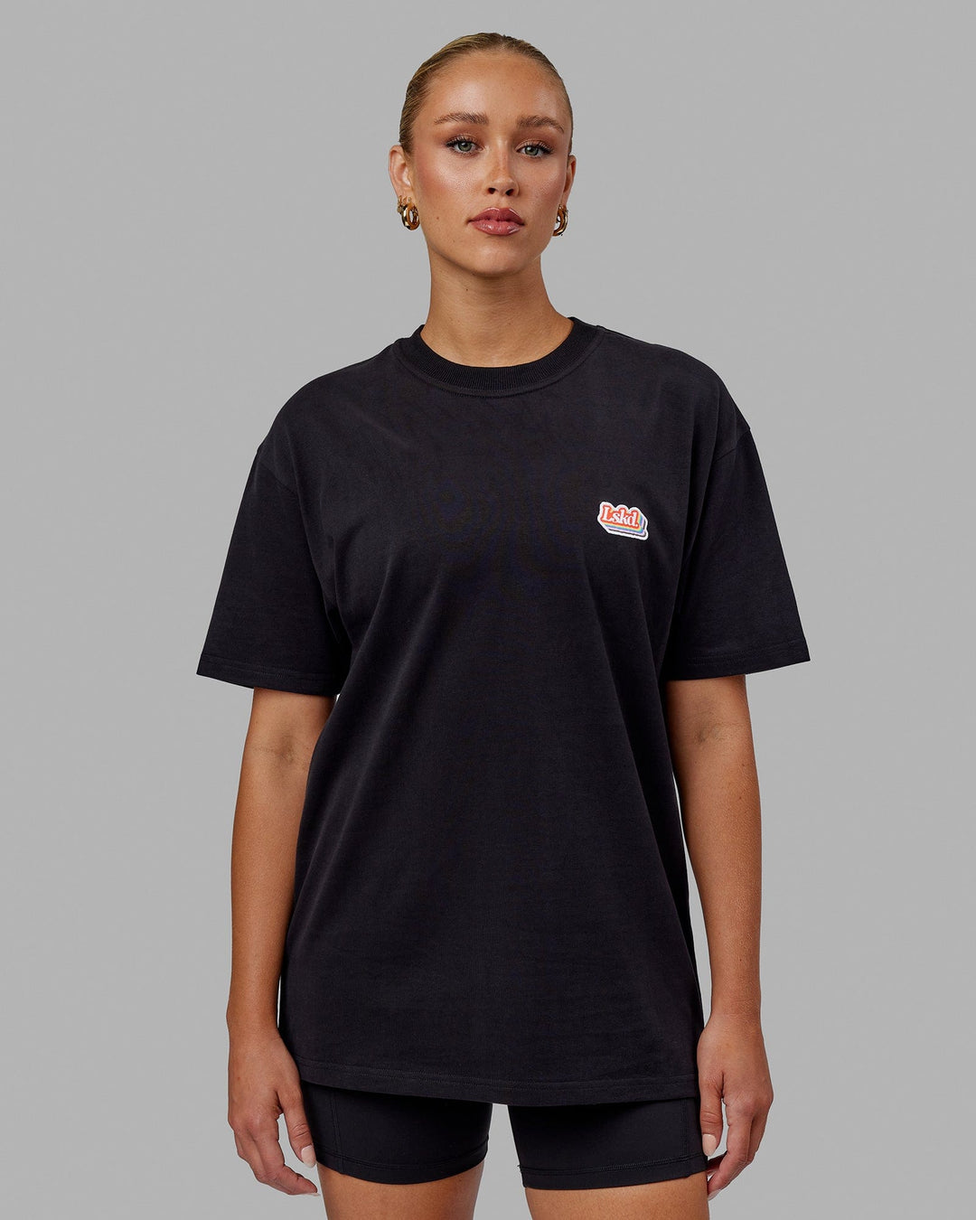 Woman wearing Unisex Radiate Heavyweight Tee Oversize - Black