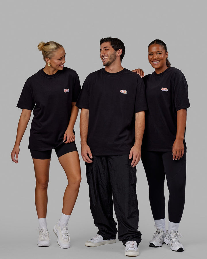 Group wearing Unisex Radiate Heavyweight Tee Oversize - Black