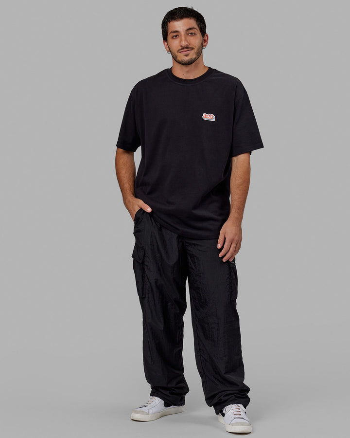 Man wearing Unisex Radiate Heavyweight Tee Oversize - Black