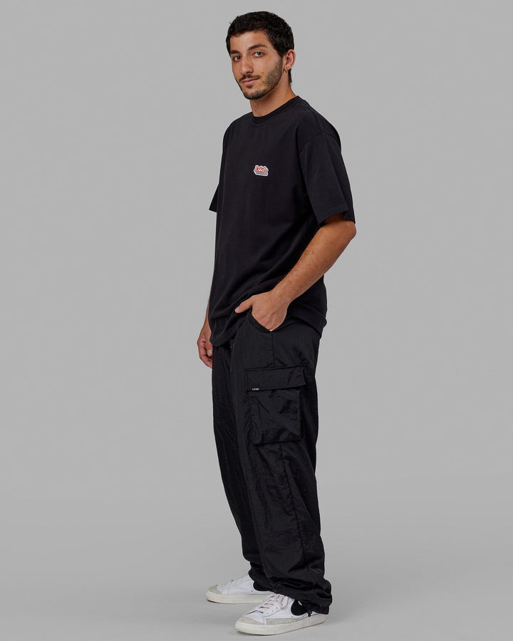 Man wearing Unisex Radiate Heavyweight Tee Oversize - Black