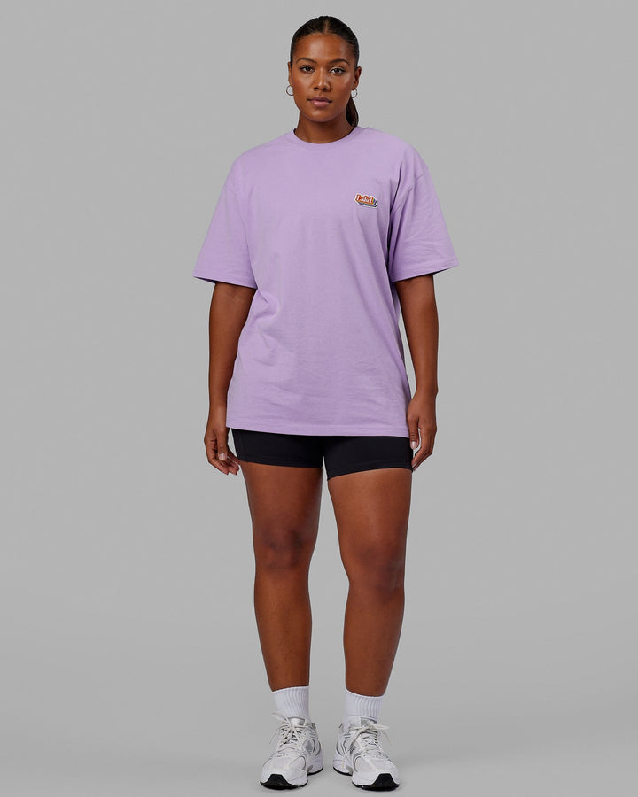Woman wearing Unisex Radiate Heavyweight Tee Oversize - Pale Lilac