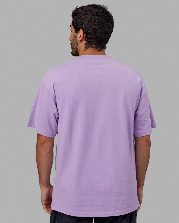 Man wearing Unisex Radiate Heavyweight Tee Oversize - Pale Lilac