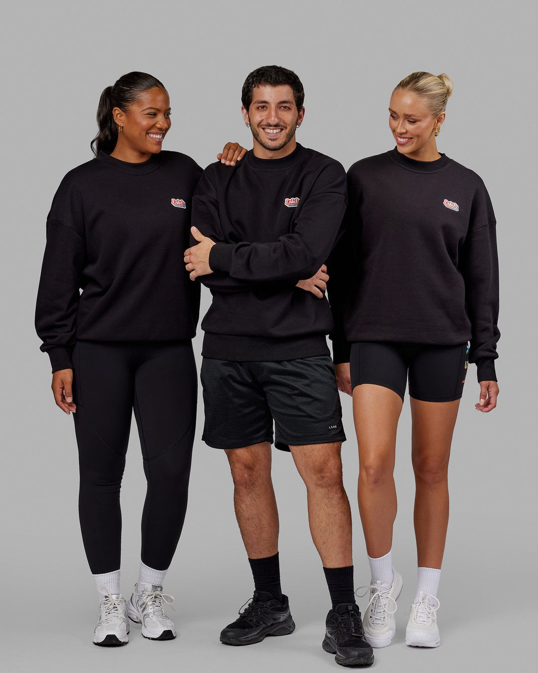Group wearing Unisex Radiate Sweater Oversize - Black