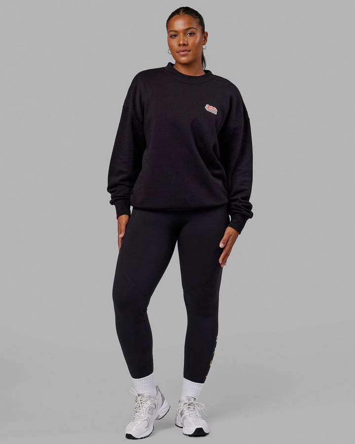 Woman wearing Unisex Radiate Sweater Oversize - Black