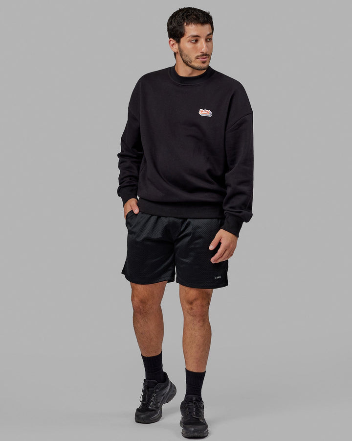 Man wearing Unisex Radiate Sweater Oversize - Black