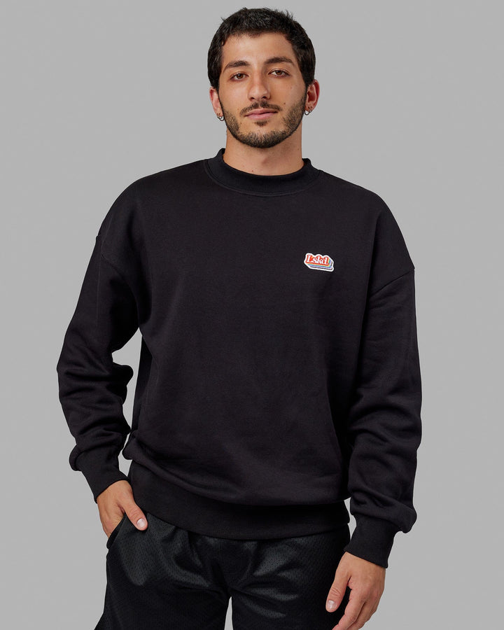 Man wearing Unisex Radiate Sweater Oversize - Black