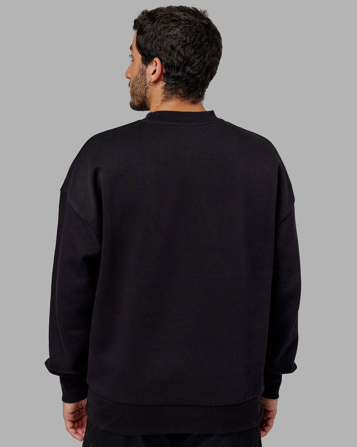 Man wearing Unisex Radiate Sweater Oversize - Black