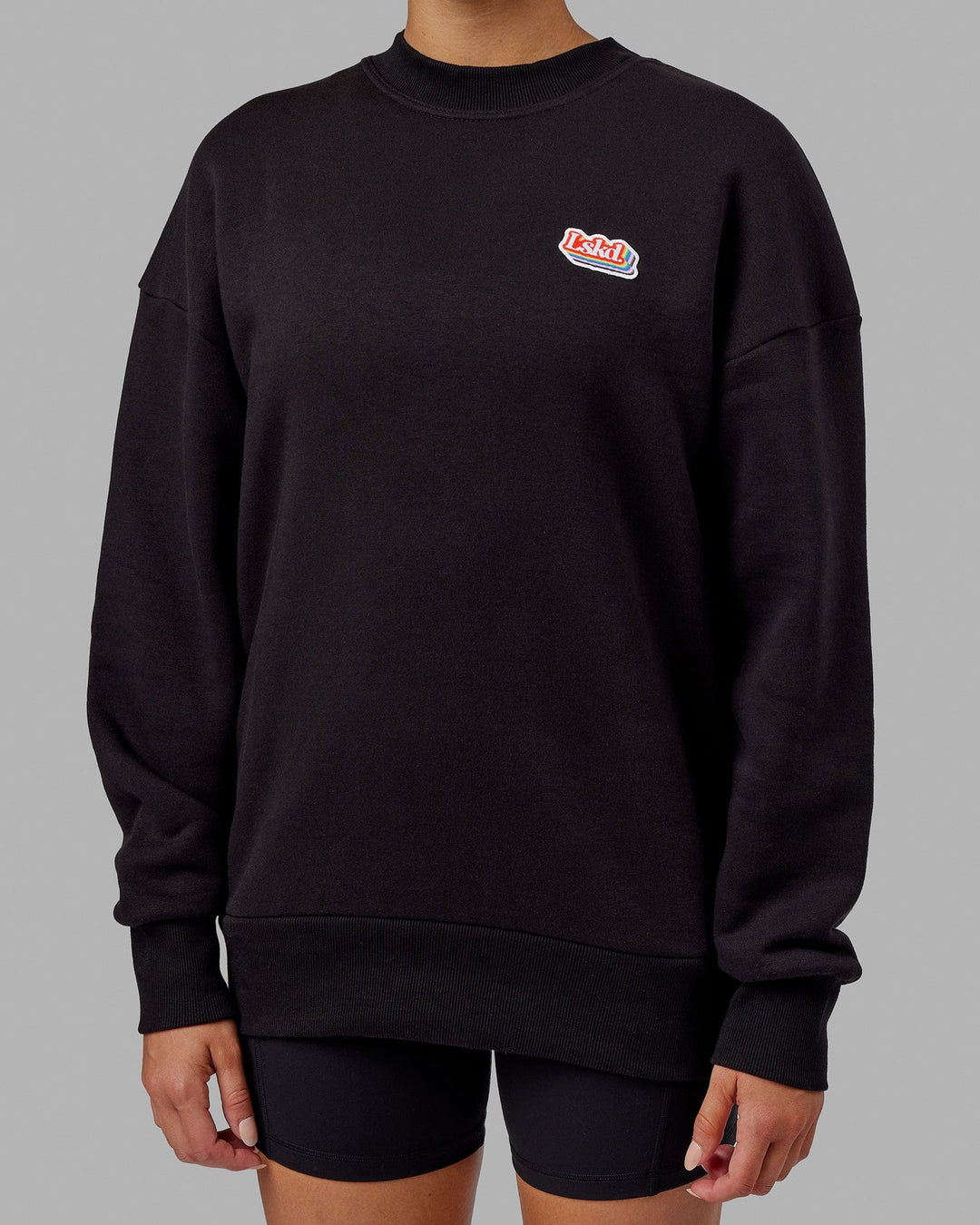 Woman wearing Unisex Radiate Sweater Oversize - Black