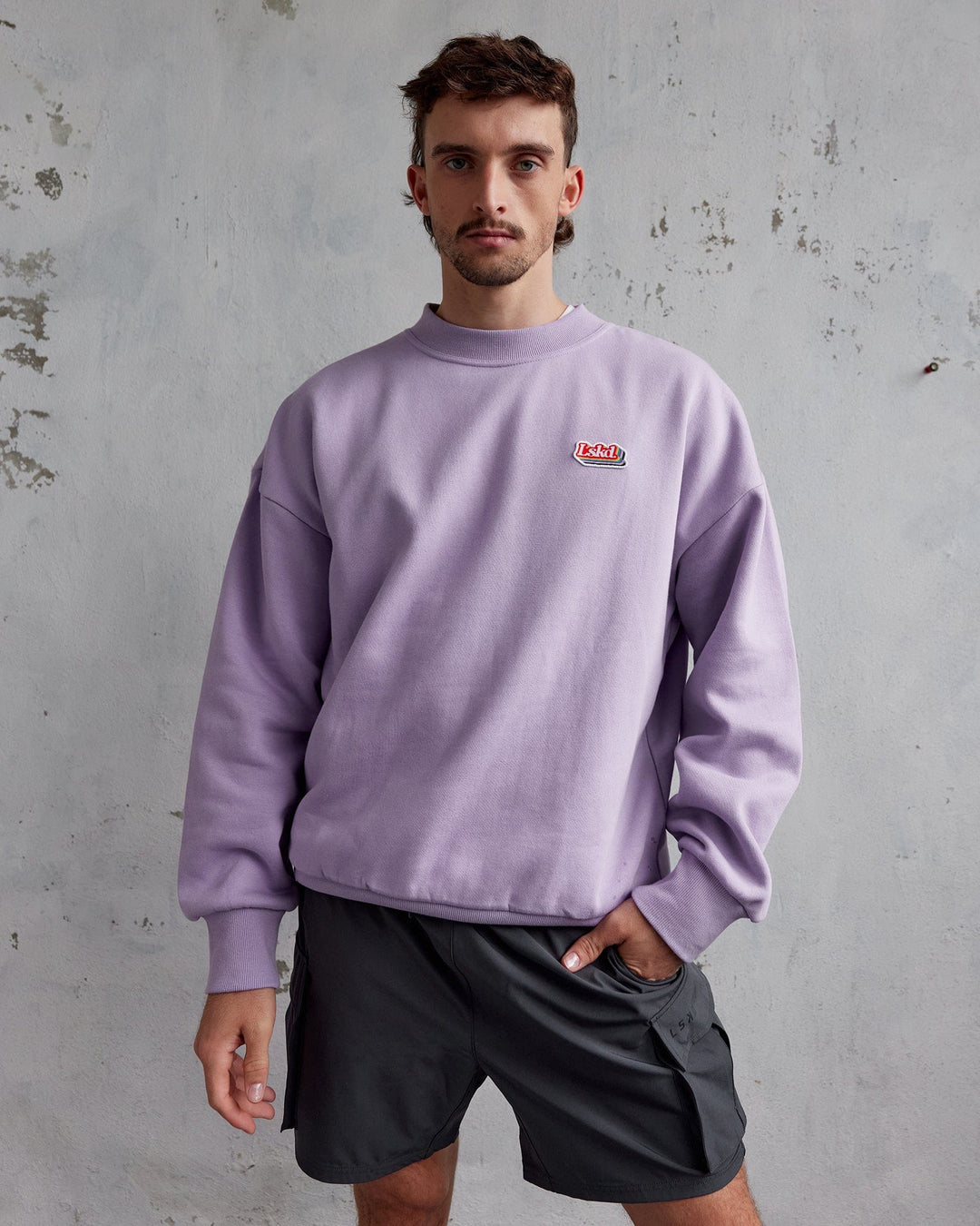 Man wearing Unisex Radiate Sweater Oversize - Pale Lilac