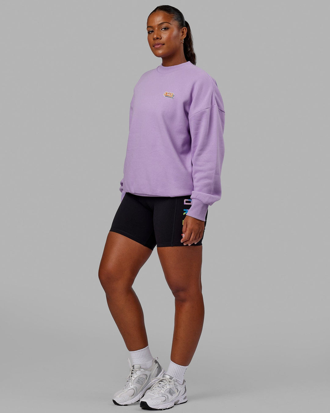 Woman wearing Unisex Radiate Sweater Oversize - Pale Lilac