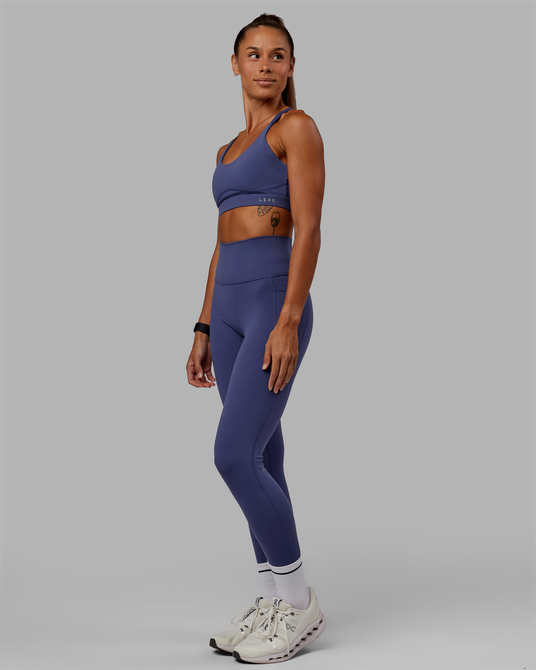 Woman wearing Rapid Sports Bra - Future Dusk