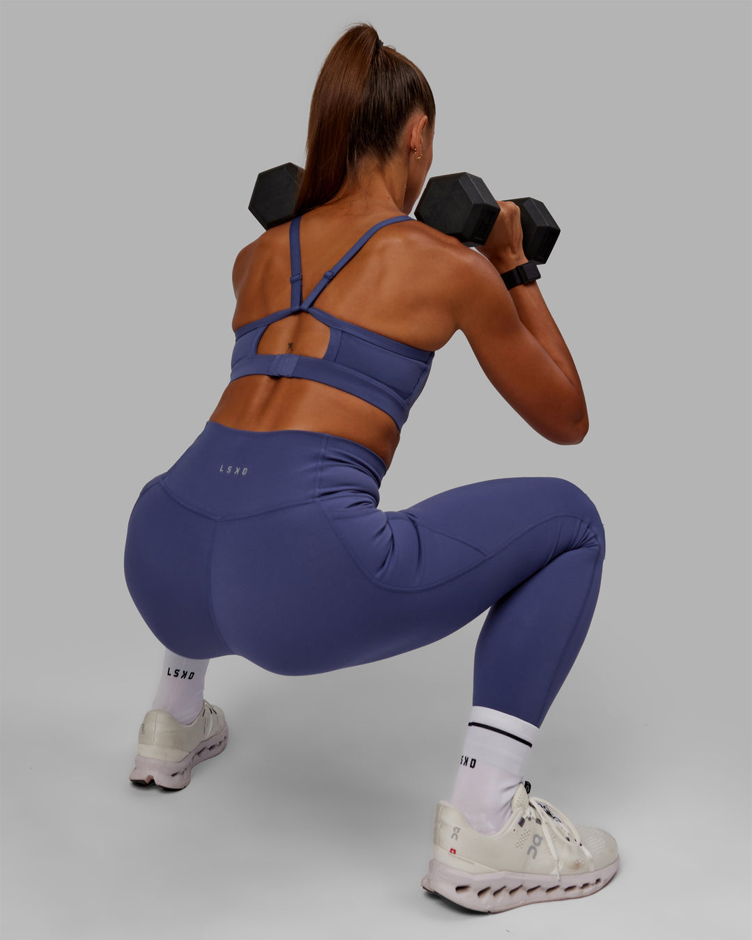 Woman wearing Rapid Sports Bra - Future Dusk