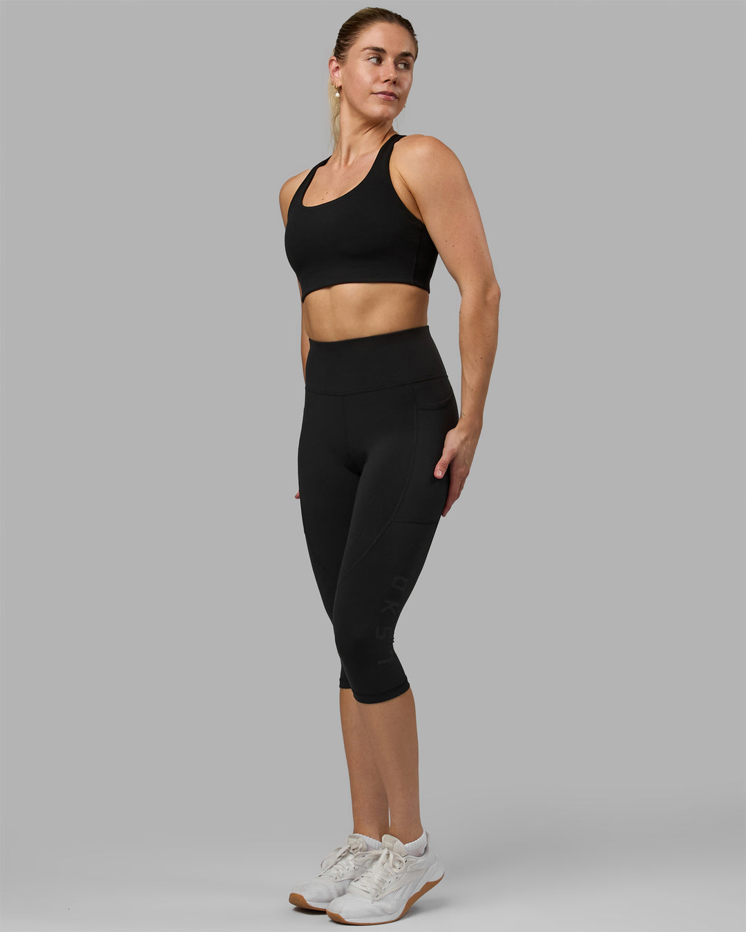 Woman wearing Rep Ultra High-Rise 3/4 Legging Pockets - Black-Black | Model:Hannah | Size:S