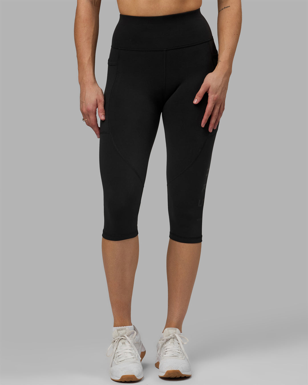 Woman wearing Rep Ultra High-Rise 3/4 Legging Pockets - Black-Black | Model:Hannah | Size:S